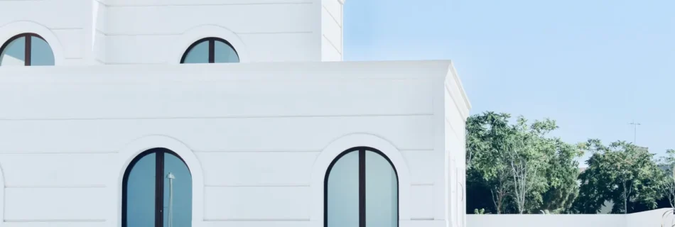 white arched building facade