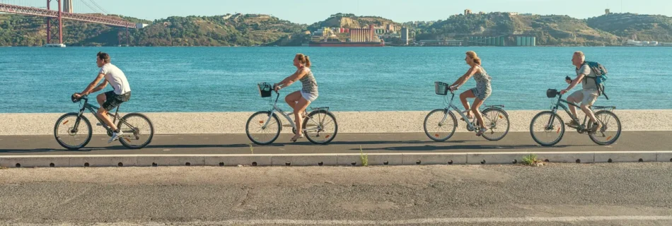 Cyclists On Lisbon Riverside