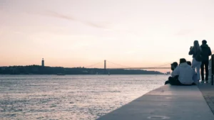 People Watching Waterfront Sunset